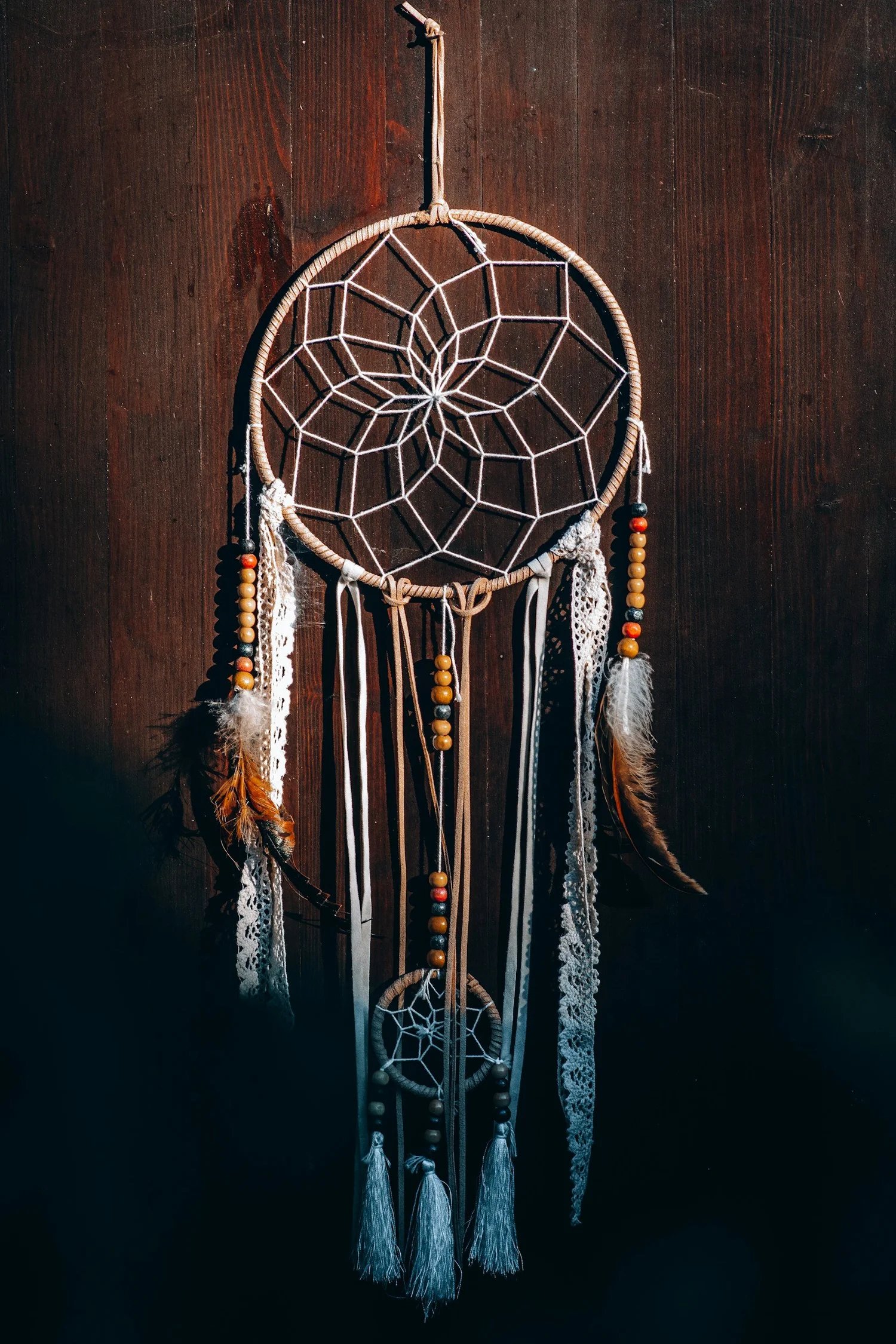 Dreamcatcher on dark wood